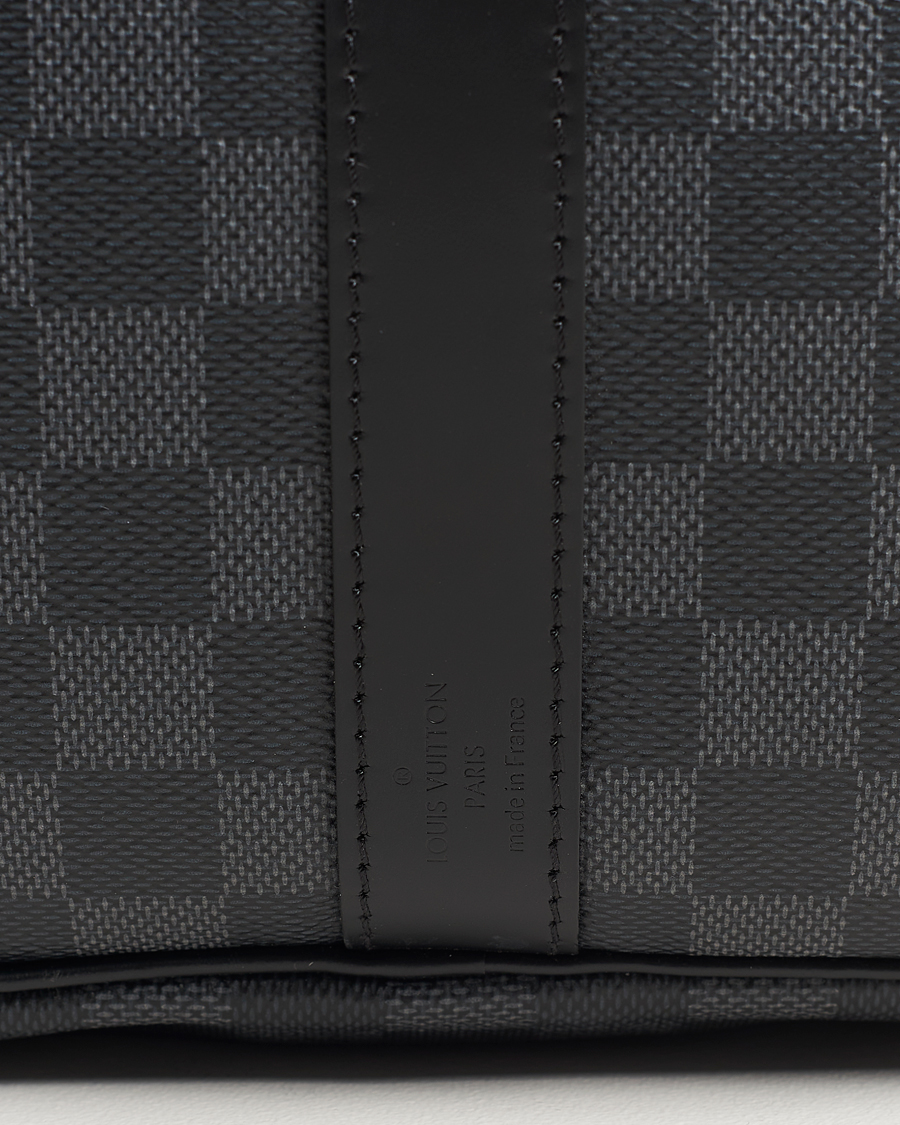 Mies | Louis Vuitton Pre-Owned Keepall Bandoulière 55 Damier Graphite | Louis Vuitton Pre-Owned | Keepall Bandoulière 55 Damier Graphite