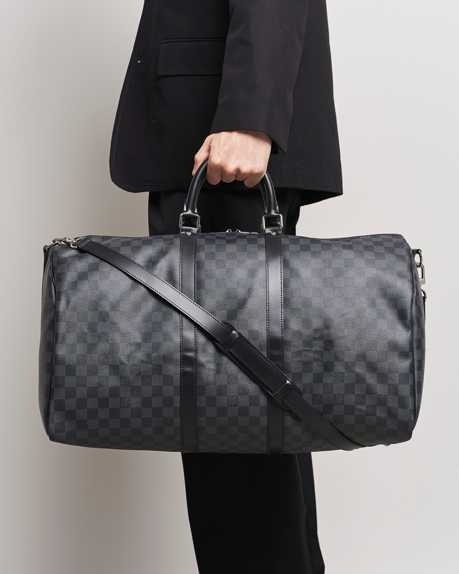 Mies | Louis Vuitton Pre-Owned Keepall Bandoulière 55 Damier Graphite | Louis Vuitton Pre-Owned | Keepall Bandoulière 55 Damier Graphite